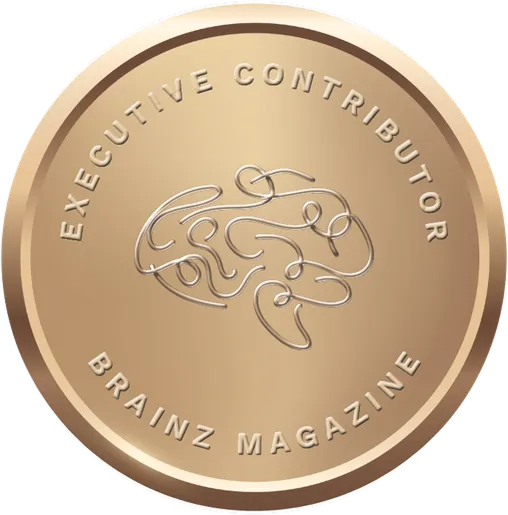 Bronze-colored circular medallion with abstract brain design and text "Executive Contributor Brainz Magazine.